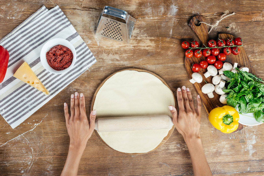 Preparing pizza base